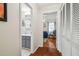 Hallway view of a bathroom with shower and a bedroom with a ceiling fan at 8728 Mcadam Pl, Tampa, FL 33634