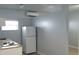 Efficient kitchen space with white cabinets, compact appliances and neutral walls at 8728 Mcadam Pl, Tampa, FL 33634