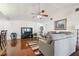 Comfortable living room with wood floors, ceiling fan, and neutral tones at 8728 Mcadam Pl, Tampa, FL 33634