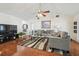 Bright living room with vaulted ceiling, wood floors, and open layout at 8728 Mcadam Pl, Tampa, FL 33634