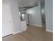 Open concept living space and kitchen area offering tile floors and neutral decor at 8728 Mcadam Pl, Tampa, FL 33634