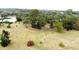 Aerial view of park-like setting with recreational opportunities, green grass and mature trees at 915 Rolling Hills Dr, Palm Harbor, FL 34683