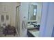 Bathroom features a shower and vanity, and a decorative towel rack with neatly folded towels at 915 Rolling Hills Dr, Palm Harbor, FL 34683