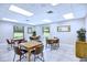Well-lit dining area with seating for six, perfect for enjoying meals and entertaining guests at 915 Rolling Hills Dr, Palm Harbor, FL 34683