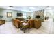 Inviting living room area with stone fireplace and comfortable seating arrangements at 915 Rolling Hills Dr, Palm Harbor, FL 34683