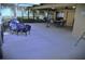 Large patio with tiled floors, comfortable seating and firepit, perfect for relaxation and outdoor enjoyment at 915 Rolling Hills Dr, Palm Harbor, FL 34683