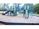 Outdoor playground featuring a climbing structure, slides, and assorted play equipment for an active lifestyle at 915 Rolling Hills Dr, Palm Harbor, FL 34683