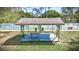 Covered picnic shelter next to tennis courts, ideal for relaxing between games at 915 Rolling Hills Dr, Palm Harbor, FL 34683