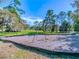 Wide view of swing sets and mulch base at 915 Rolling Hills Dr, Palm Harbor, FL 34683