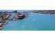 Aerial view of waterfront property with marina and building at 1 Key Capri # 303E, Treasure Island, FL 33706