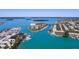 Fantastic aerial view of waterfront condos, marina, and boat docks on a sunny day at 1 Key Capri # 303E, Treasure Island, FL 33706
