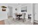 Cozy dining area with stylish chairs, a round table, and decorative wall art at 1 Key Capri # 303E, Treasure Island, FL 33706