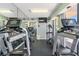 Well-equipped gym boasts multiple treadmills and workout machines for resident use at 1 Key Capri # 303E, Treasure Island, FL 33706