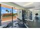 Bright gym features weight machines and expansive windows overlooking the neighborhood at 1 Key Capri # 303E, Treasure Island, FL 33706