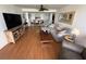 Comfortable living room with cozy seating and wood-style floors at 1 Key Capri # 303E, Treasure Island, FL 33706
