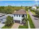 Beautiful two-story home with a two-car garage, balcony, and lush landscaping at 101 Biscayne Ave, Tampa, FL 33606