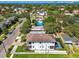 Wide aerial shot showcasing the neighborhood, tree coverage, and the home's proximity to the waterfront at 101 Biscayne Ave, Tampa, FL 33606