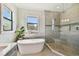 Elegant bathroom featuring a soaking tub, glass shower, and decorative tile work at 101 Biscayne Ave, Tampa, FL 33606