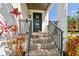 Inviting front porch with brick steps and a modern black front door featuring glass panels at 101 Biscayne Ave, Tampa, FL 33606
