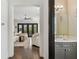 Hallway view showcasing the open floor plan, with a glimpse of the living area and powder room at 101 Biscayne Ave, Tampa, FL 33606