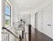 Bright upstairs hallway features dark hardwood floors, white walls, and a staircase to the lower level at 101 Biscayne Ave, Tampa, FL 33606