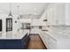 Gourmet kitchen with a large island, white and navy cabinetry, and stainless steel appliances at 101 Biscayne Ave, Tampa, FL 33606