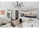 Stylish living room open to a modern kitchen, featuring a white sectional sofa and hardwood floors at 101 Biscayne Ave, Tampa, FL 33606