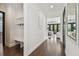 Mudroom with built-in storage, bench, and dark wood floors at 101 Biscayne Ave, Tampa, FL 33606