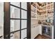 Walk-in pantry with custom shelving, wine fridge, and granite countertops at 101 Biscayne Ave, Tampa, FL 33606