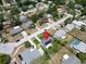 Aerial view of home, showcasing the neighborhood with manicured lawns and mature trees at 1011 Coldstream Ct, Tarpon Springs, FL 34689