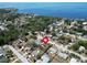 Aerial view showing the home's location near the water and the beautiful neighborhood at 1011 Coldstream Ct, Tarpon Springs, FL 34689
