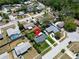 Aerial view of a home with solar panels, showcasing the neighborhood's charm at 1011 Coldstream Ct, Tarpon Springs, FL 34689