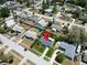 Home with manicured lawn in a quiet neighborhood; aerial shows proximity to amenities at 1011 Coldstream Ct, Tarpon Springs, FL 34689