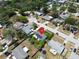 Aerial view of the home featuring solar panels, a well-maintained yard, and neighborhood at 1011 Coldstream Ct, Tarpon Springs, FL 34689