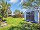 Backyard featuring well maintained lawn, a shed and a wood fence for privacy at 1011 Coldstream Ct, Tarpon Springs, FL 34689