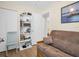 Spare bedroom with futon, bookshelf, and views to another bedroom at 1011 Coldstream Ct, Tarpon Springs, FL 34689