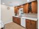 Well-appointed kitchen with wood cabinetry, modern appliances, and a bright, clean aesthetic at 1011 Coldstream Ct, Tarpon Springs, FL 34689