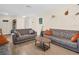 Inviting living room with stylish sofas, wood-look tile flooring, and tasteful decor at 1011 Coldstream Ct, Tarpon Springs, FL 34689