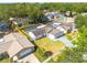 Aerial view of home with a well-manicured lawn in a lush, green neighborhood at 104 Meadowcross Dr, Safety Harbor, FL 34695
