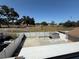 A spacious fenced-in backyard with a shed and green space behind the fence at 10414 Rosemount Dr, Tampa, FL 33624