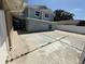 Backyard showcasing the concrete patio area, leading up to the two-story home at 10414 Rosemount Dr, Tampa, FL 33624