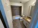 Cozy bathroom with granite countertops, neutral tile, and a shower-tub combo at 10414 Rosemount Dr, Tampa, FL 33624