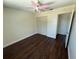 This cozy bedroom is complete with ceiling fan, bi-fold closet, and wood-look flooring at 10414 Rosemount Dr, Tampa, FL 33624