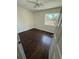 Bedroom with a window, ceiling fan and dark hardwood floors at 10414 Rosemount Dr, Tampa, FL 33624