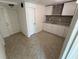 The kitchen features modern cabinets, granite counters, a stylish backsplash, and tile flooring at 10414 Rosemount Dr, Tampa, FL 33624