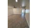 Spacious living room is complete with a modern ceiling fan and updated flooring at 10414 Rosemount Dr, Tampa, FL 33624