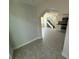 Open living space featuring a staircase, modern tile flooring and open concept kitchen at 10414 Rosemount Dr, Tampa, FL 33624