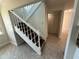 Bright foyer featuring a staircase with white railings and wood treads leading to the upper level at 10414 Rosemount Dr, Tampa, FL 33624
