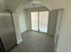 Bright sunroom with tile flooring and sliding glass doors at 10414 Rosemount Dr, Tampa, FL 33624