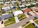 An aerial view shows a well-maintained home with a neatly landscaped yard on a sunny day at 11225 59Th Ave, Seminole, FL 33772
